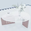 Modern Glass Top Coffee Table With White Flowers Books And Candle Holders On Carpet