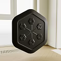 Black Hexagonal Object With Dumbbell Patterns In Room With Window And Wooden Floor