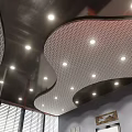 Modern Office Ceiling with Wavy Texture Recessed Lights Windows Blinds and Decorative Art