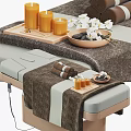 Modern Massage Bed With Wood Frame Plush Blanket Rolled Towels Essential Oils In SPA Setting