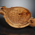 Ancient Ceramic Artifact With Carved Patterns Two Holes And Traditional Design