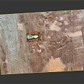 Yellow CAT Bulldozer With Tracks And Blade On Red Soil Ground