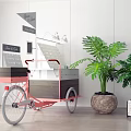 Pink And Gray Three Wheeled Utility Cart With Green Plants In Indoor Space