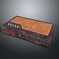 PC Accessory Device With Brown Casing Orange Grill Pattern Buttons And Interface Ports