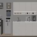 Modern Kitchen With White Cabinets And Daily Electrical Appliances Like Coffee Maker And Water Dispenser