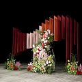 Wedding Decoration Setup With Vertical Red Orange Panels And Floral Arrangement On Wooden Floor