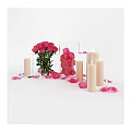 Elegant Pink Roses in Transparent Vase with Scattered Petals and Decorative Candles
