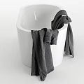 Elegant Modern White Bathtub With White Gray And Beige Towels Hanging