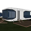 Modern Boutique Guesthouse Building With Large Glass Windows Wooden Deck And Waterfront View
