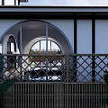 Modern Courtyard Garden Design With Arched Glass Walls And Seamless Indoor Outdoor Flow