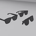 Three Pairs of Black Sunglasses with Black Frames and Black Lenses