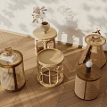 Various Rattan Side Tables With Decorative Vase And Books On Wooden Floor