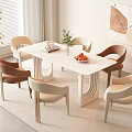 Modern Dining Table Set with Beige Brown Chairs Green Plant Fruit Bowl and Wall Art