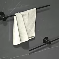 Modern Bathroom Towel Bars With Black Finish On Marble Wall And White Towel