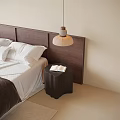 Light Shade Dark Base Pendant Light in Bedroom with Wooden Headboard Open Book on Nightstand