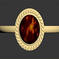 Elegant Gold Ring With Red Gemstone And Intricate Golden Decorative Edge