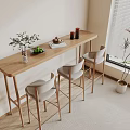 Modern Wooden Bar Counter With Grey High Stools Green Plants Fruits Books Decorations By Window