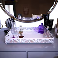 Light Purple Dressing Table With Round Mirror Cosmetics On Tray Wooden Chair And Green Plant