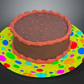 Delicious Chocolate Cake With Red Frosting Border On Colorful Polka Dot Plate