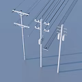 Industrial Equipment Featuring Tall White Electric Poles With Multiple Power Lines