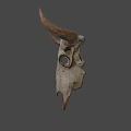 Weathered Bull Skull Against Blue Sky With Dry Land And Trees