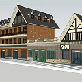 Traditional Commercial Street With Brick Facade And Tudor Style Roofs And Storefronts