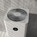 Sleek White Upright Air Purifier Daily Appliance With Modern Design In Gray Wall Interior