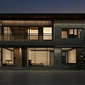 Two Story Guesthouse Building With Wooden Stone Exterior Large Windows And Warm Night Lighting