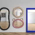 Various Colored Shaped Mirrors on White Wall with Herringbone Wooden Floor Indoor Reflection