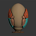 Carved Egg Shaped Sculpture With Golden Body Red Green Accents And Wooden Base
