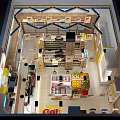 Bright Supermarket Department Store Interior With Sol Logo Checkout Counter And Product Shelves