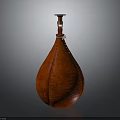 Red Leather Teardrop Shaped Decorative Vase With White Stitching And Black Lid