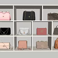 Fashionable Designer Bags In Various Styles And Colors On White Display Shelves