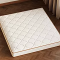 White Quilted Mattress With Diamond Stitch Pattern On Wooden Floor