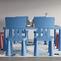 Playful Kids Table With Blue Pink Chairs And Toys On Rug And Light Colored Walls