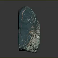 Green Raw Stone with Copper Spots and Natural Texture on Dark Reflective Surface