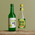 Two Green Transparent Wine Bottles With Champagne Dewdrop And Calamansi Fruit Flavors Bilingual Labels