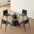 Modern Round Glass Top Dining Table Set with Four Black Chairs on Wooden Floor