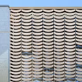 Modern Facade With Wavy Metal Panels Glass Entrance Door Stone Steps Water Feature And Greenery