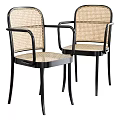 Elegant Modern Leisure Chairs With Black Metal Frames And Woven Rattan Seats Backs