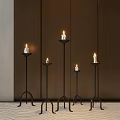 Multiple Black Metal Candle Lamps In Different Heights With Dark Wooden Wall And Light Carpet