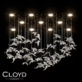 Modern Artistic Chandelier With Silver Decorative Elements Multiple Illuminated Bulbs Hanging On Black Background