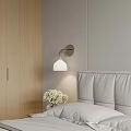 Modern Double Bed With Upholstered Headboard Wall Lamp Nightstand And Vase With White Flowers