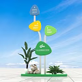 Colorful Directional Signage With Blue Yellow Green Arrows And Green Plants In Outdoor Space