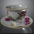 Porcelain Teacup and Saucer with Colorful Floral Patterns and Gold Rim