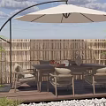 Outdoor Patio Table with Wicker Chairs Large Umbrella Wooden Deck Bamboo Fence and Green Plants