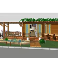 Wooden Cottage Exterior Featuring Sloped Roof Veranda Steps Railing Green Plants And Flowers