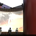 People Watching Cultural Performance Under Starry Sky Ceiling With Red Decorative Walls And Traditional Railings