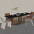 Modern Dining Table Set With Black Tabletop White Brown Chairs Green Plant Vase And Book