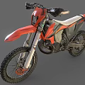 Orange and Black Motocross Motorcycle With Large Off Road Tires And White Seat